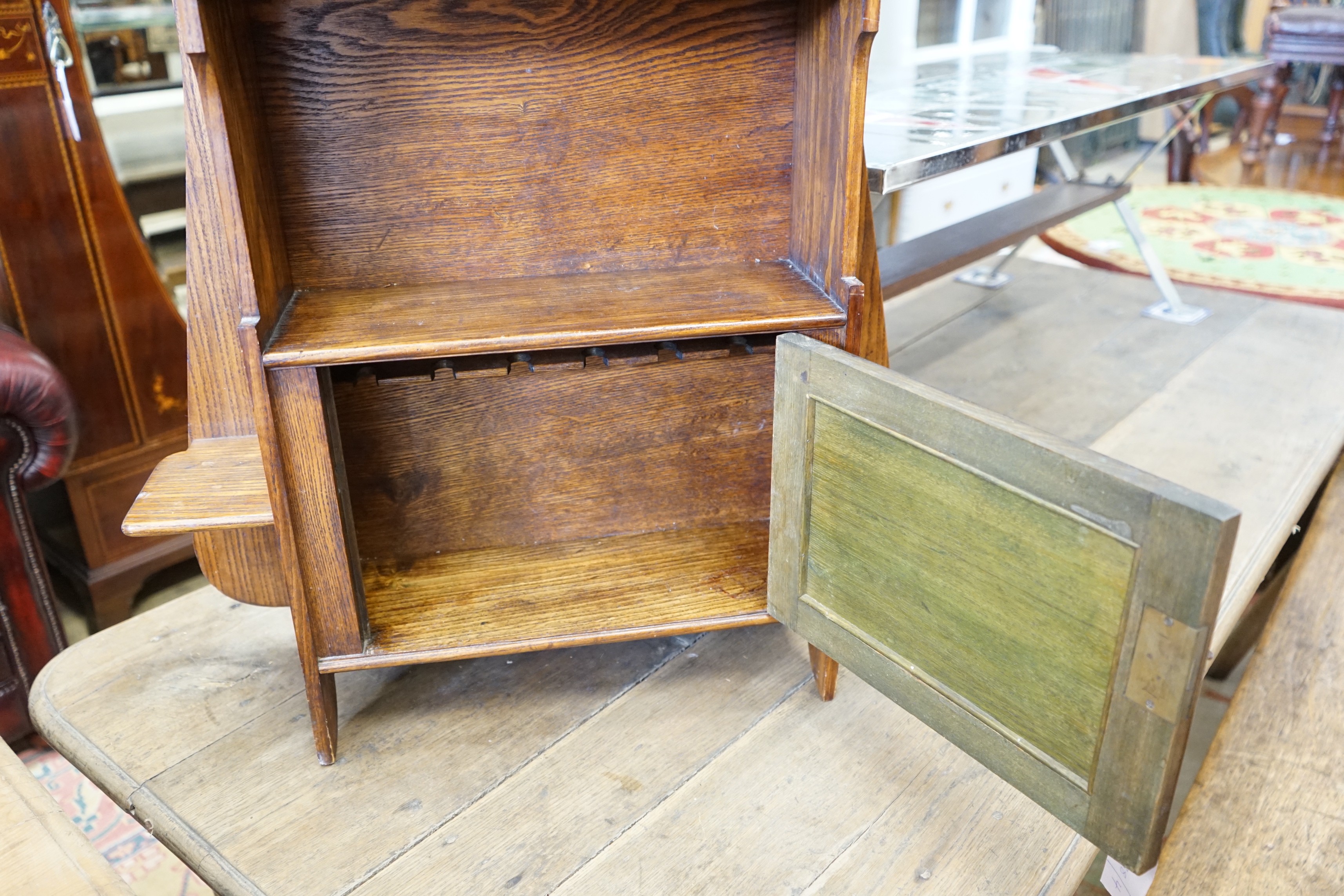 An Arts and Crafts oak wall cabinet, width 66cm, height 76cm